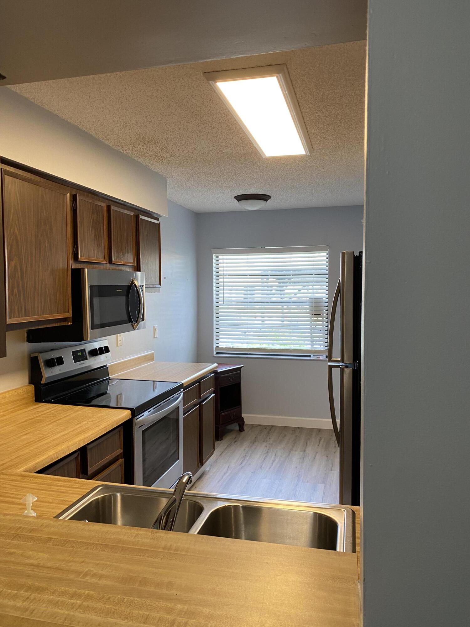 6038 Indrio Road, Unit 2 Fort Pierce, FL 34951 - Photo 3 of 13 IPV KITCHEN 2