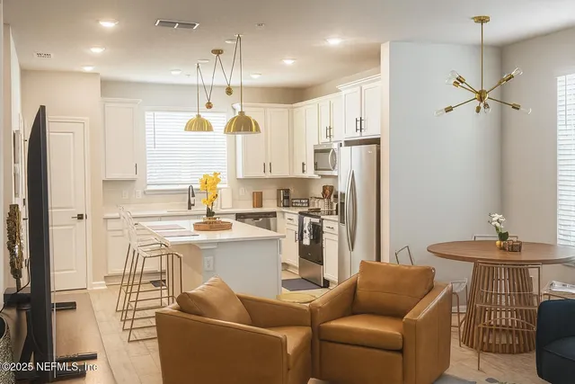 a bathroom with a double vanity sink toilet mirror and shower