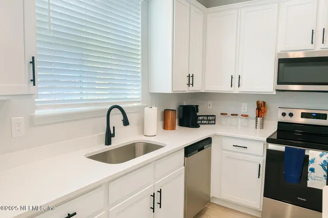 a bedroom with a bed and couch