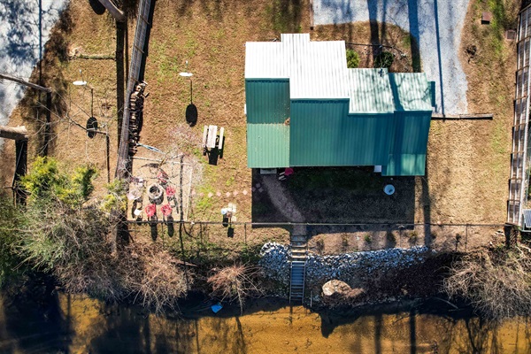 200 Laurel And Hardy Lake Road Marietta, SC 29661 - Photo 21 of 47 This aerial view showcases a peaceful lakeside retreat with a private dock.