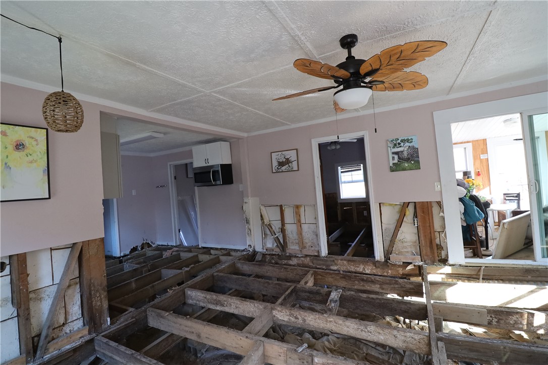 200 Laurel And Hardy Lake Road Marietta, SC 29661 - Photo 25 of 47 This interior space reveals exposed floor joists, offering a glimpse into renovation potential.