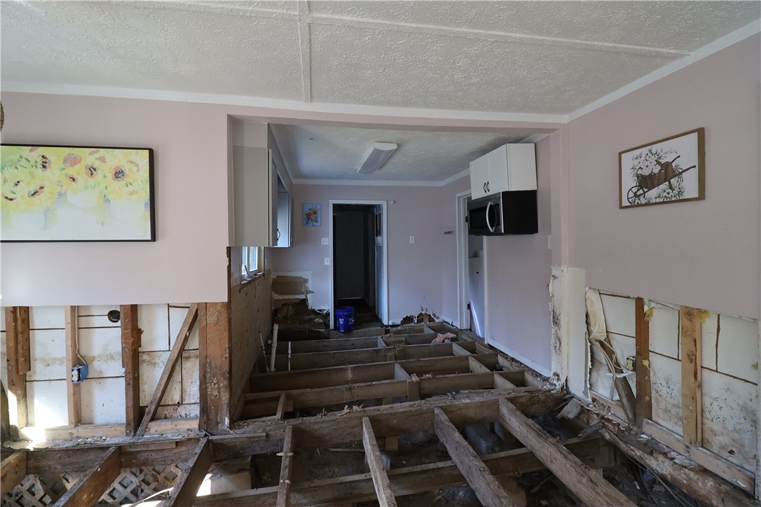 200 Laurel And Hardy Lake Road Marietta, SC 29661 - Photo 26 of 47 This interior space reveals exposed floor joists, offering a unique opportunity for custom design.