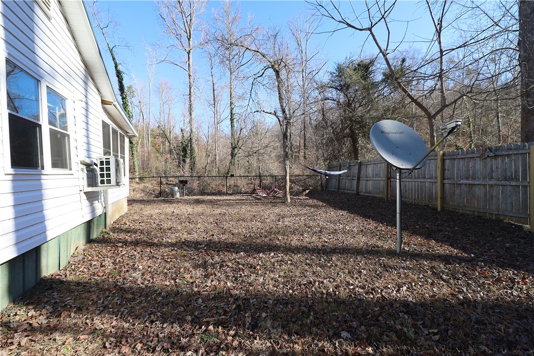 200 Laurel And Hardy Lake Road Marietta, SC 29661 - Photo 28 of 47 This spacious backyard offers privacy with natural surroundings.