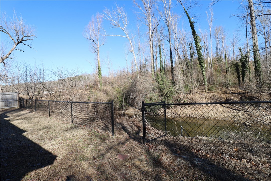 200 Laurel And Hardy Lake Road Marietta, SC 29661 - Photo 29 of 47 This property features a tranquil creek, offering a peaceful retreat amidst nature's embrace.