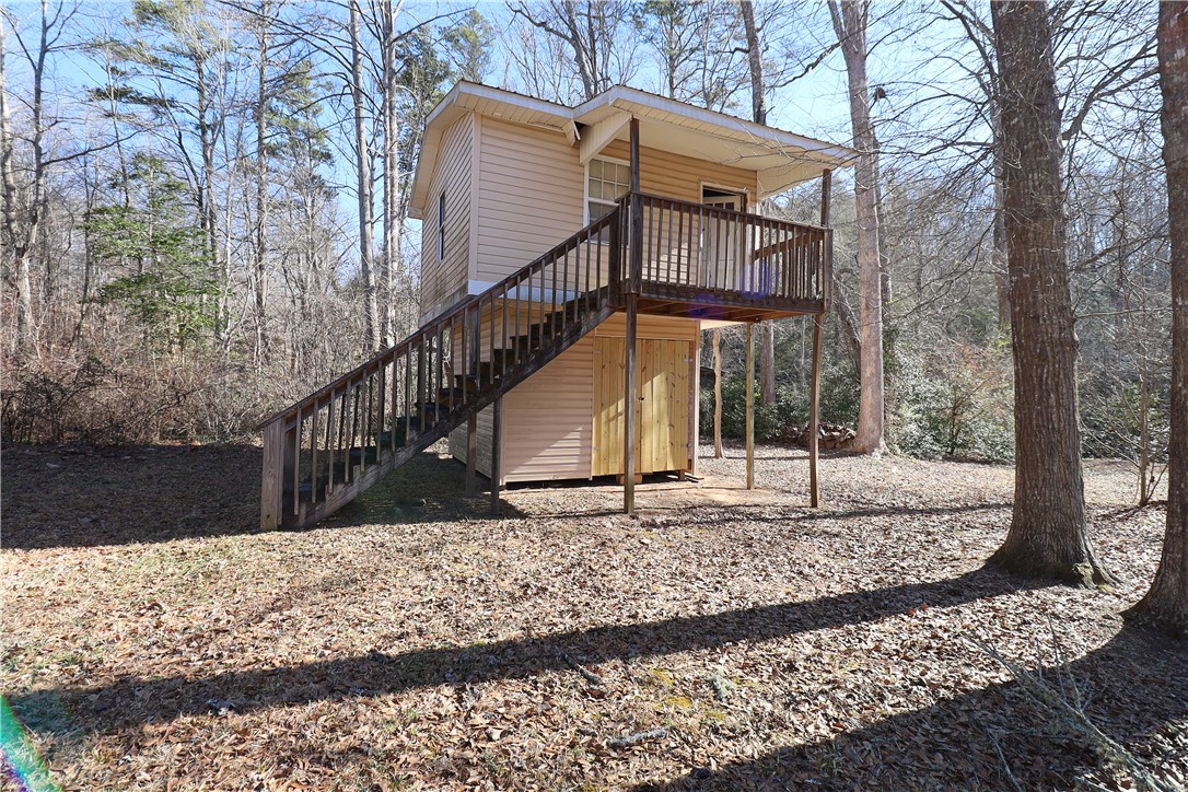 200 Laurel And Hardy Lake Road Marietta, SC 29661 - Photo 32 of 47 This charming elevated structure offers a private retreat nestled among mature trees.
