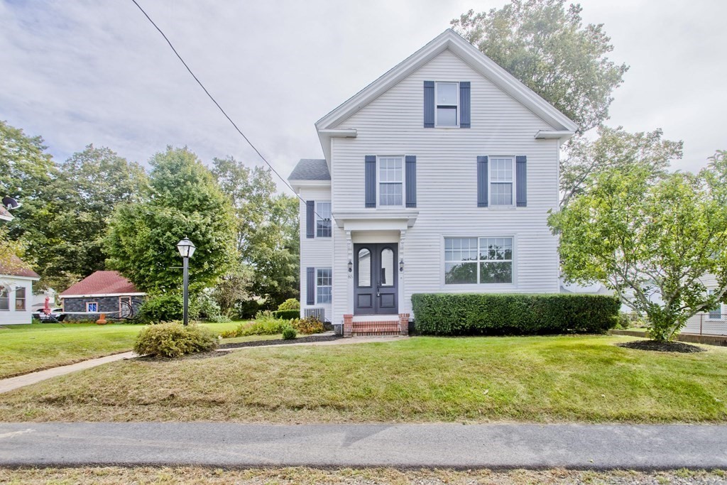 85 Chapel Street Warren, MA 01092 - Photo 1 of 42 a front view of a house with a yard