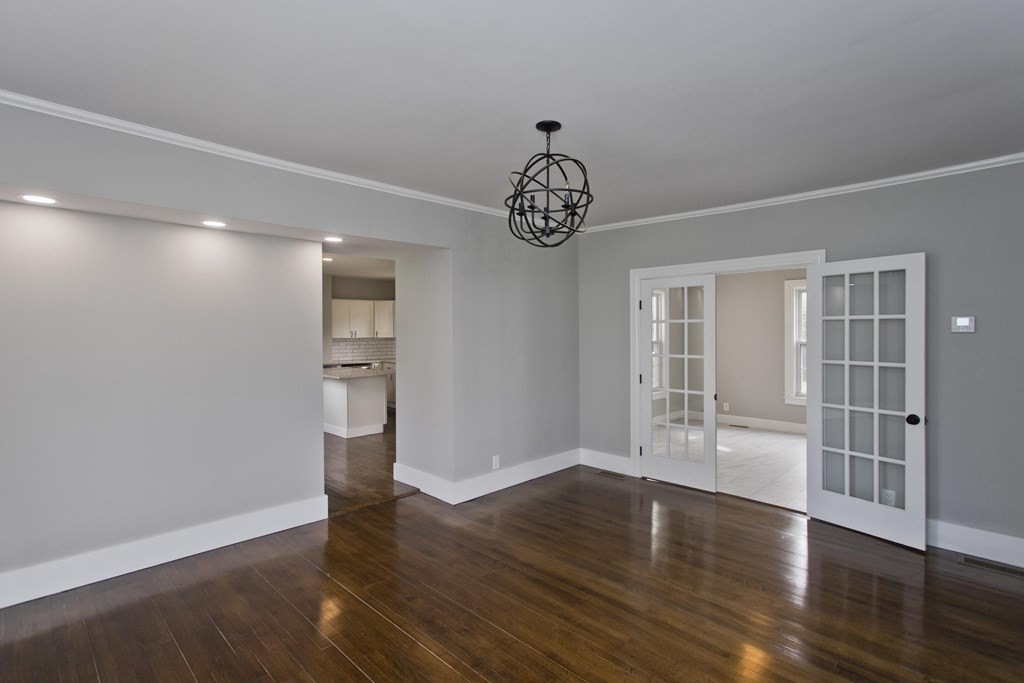 85 Chapel Street Warren, MA 01092 - Photo 11 of 42 a view of empty room with wooden floor and window