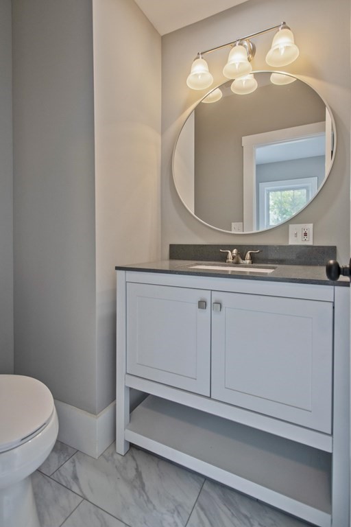 85 Chapel Street Warren, MA 01092 - Photo 15 of 42 a bathroom with a sink a mirror and a toilet
