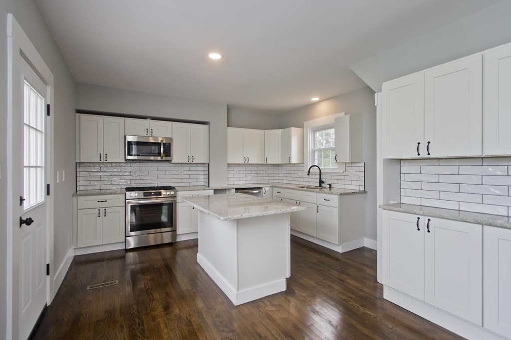85 Chapel Street Warren, MA 01092 - Photo 16 of 42 a kitchen with white cabinets and white appliances