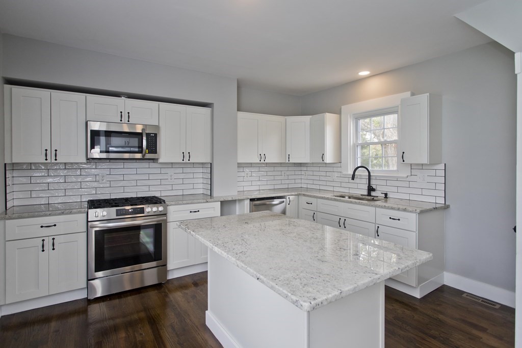 85 Chapel Street Warren, MA 01092 - Photo 17 of 42 a kitchen with a sink stove top oven and microwave