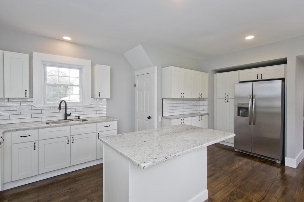 85 Chapel Street Warren, MA 01092 - Photo 19 of 42 a kitchen with a sink refrigerator and cabinets