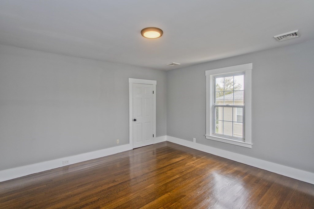 85 Chapel Street Warren, MA 01092 - Photo 25 of 42 a view of empty room with wooden floor and fan