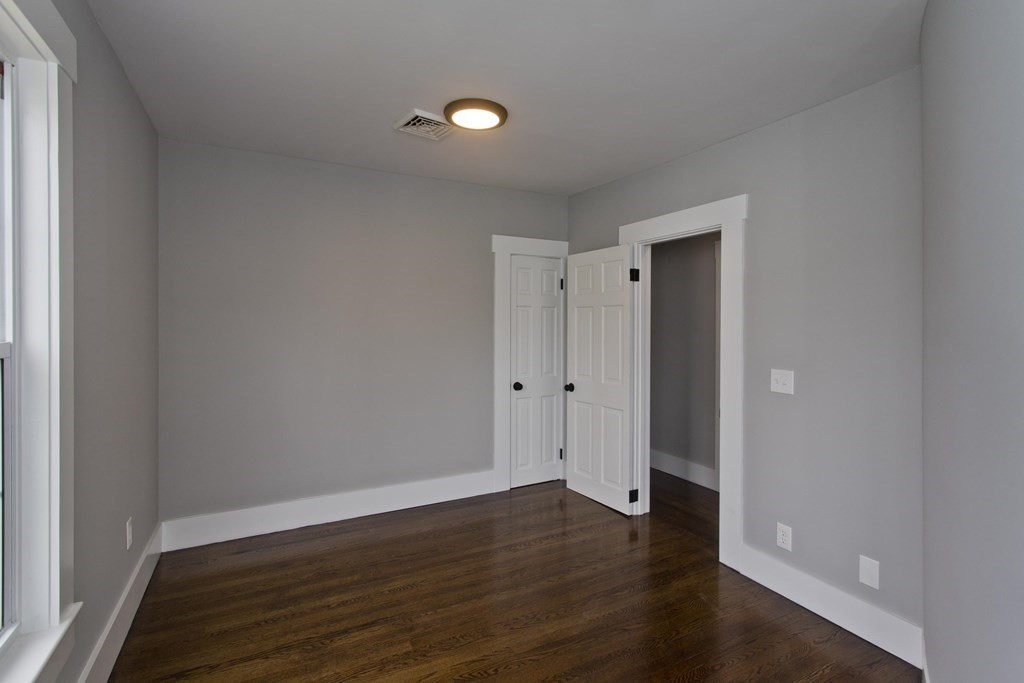 85 Chapel Street Warren, MA 01092 - Photo 29 of 42 a view of an empty room and wooden floor