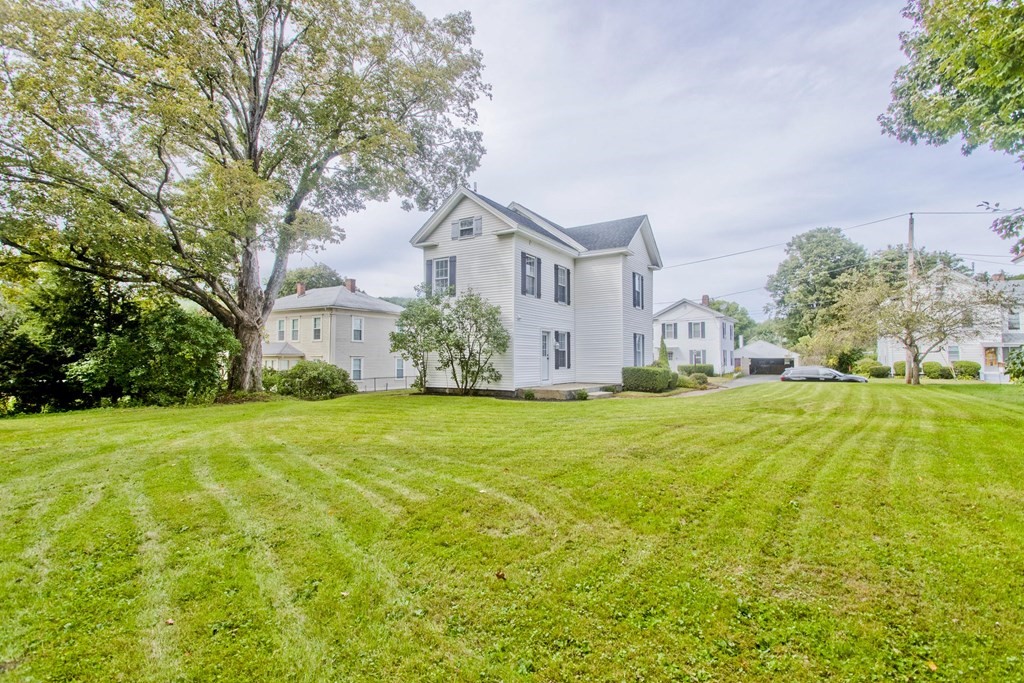85 Chapel Street Warren, MA 01092 - Photo 3 of 42 a front view of house with yard and trees