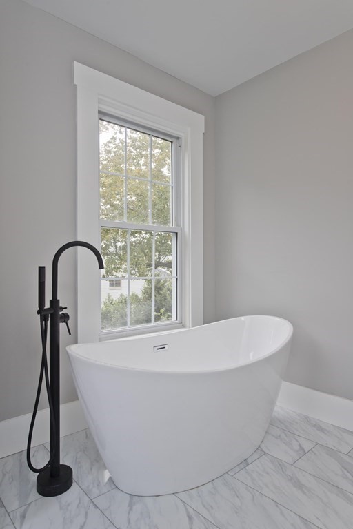 85 Chapel Street Warren, MA 01092 - Photo 38 of 42 a white bath tub sitting in a bathroom