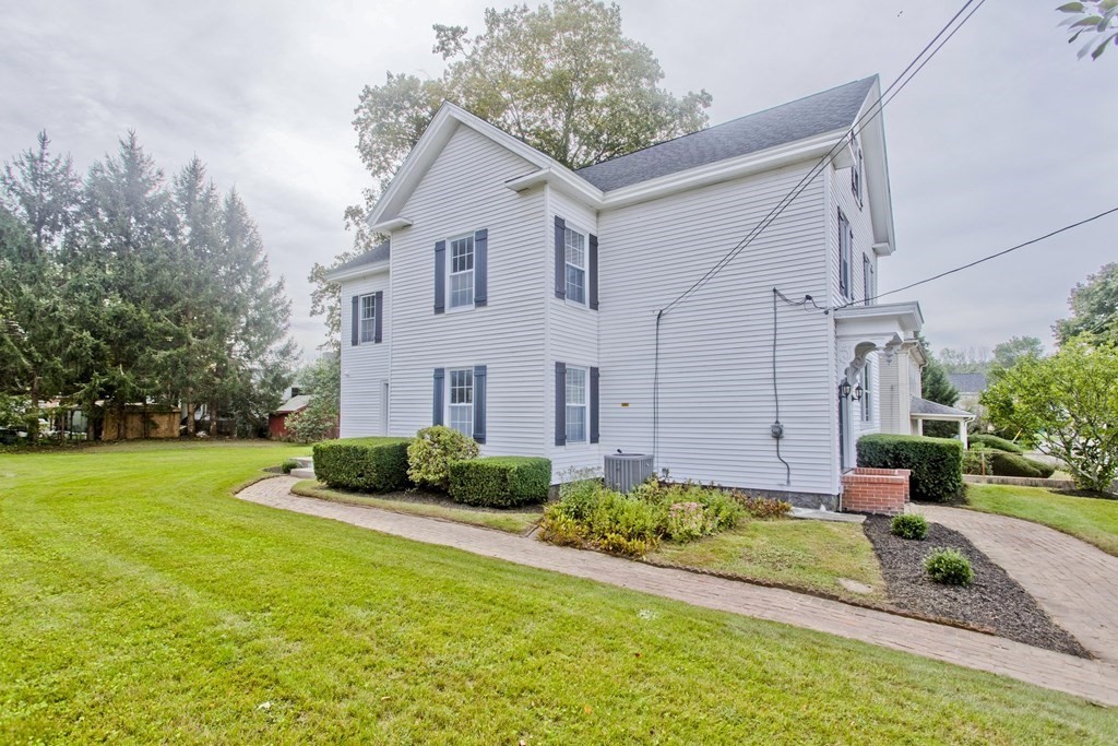 85 Chapel Street Warren, MA 01092 - Photo 42 of 42 a front view of a house with a yard