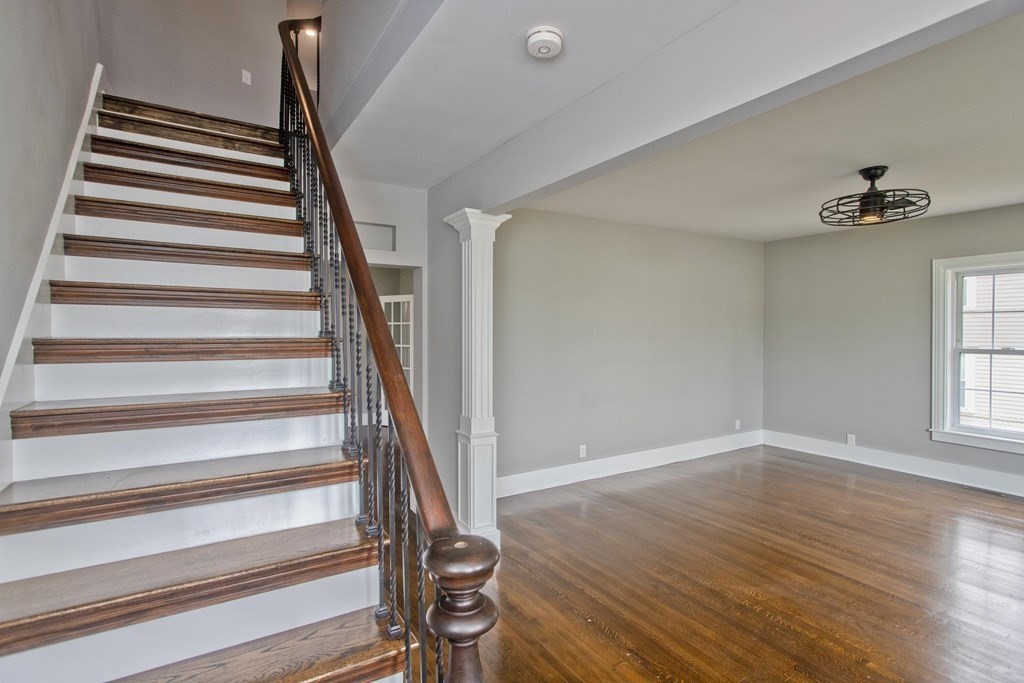 85 Chapel Street Warren, MA 01092 - Photo 6 of 42 a view of entryway with wooden floor and stairs