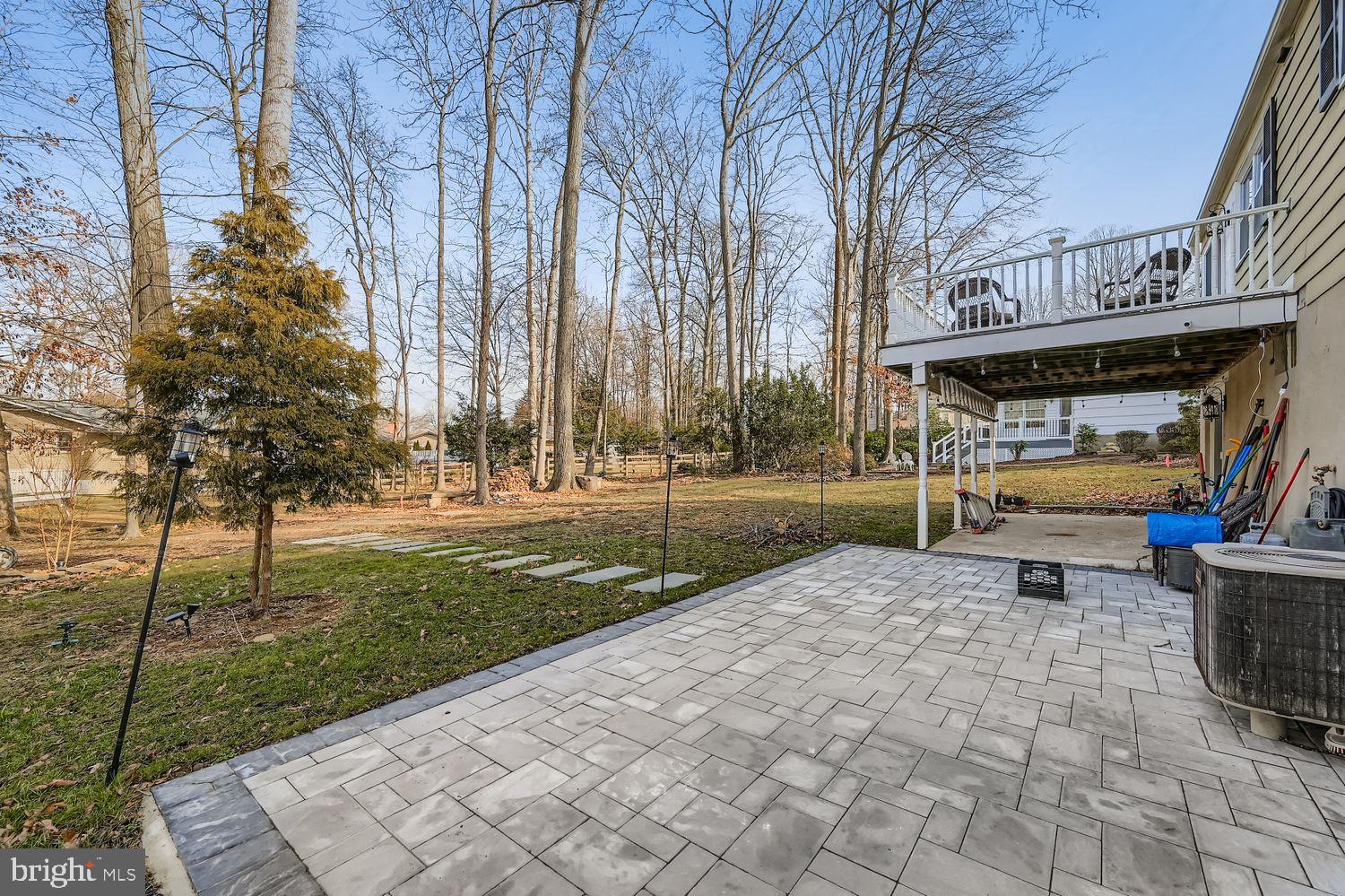 603 Deep Ridge Road Bel Air, MD 21014 - Photo 31 of 35 Serene backyard retreat with lush greenery.
