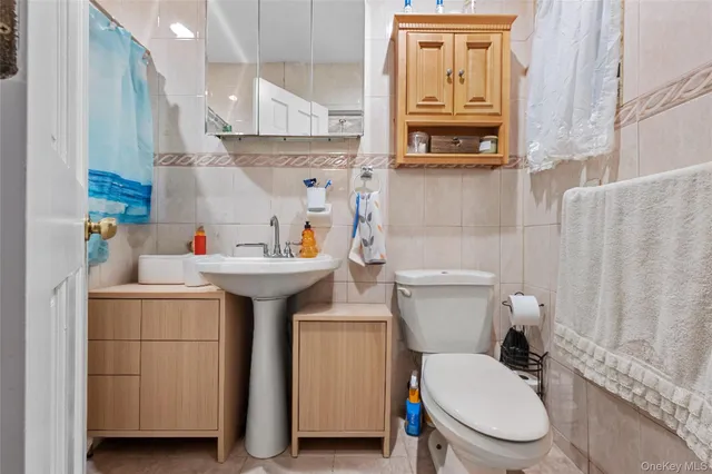 a view of staircase with railing and white walls