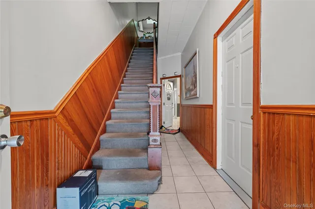 a kitchen with stainless steel appliances granite countertop a sink a stove a refrigerator and cabinets