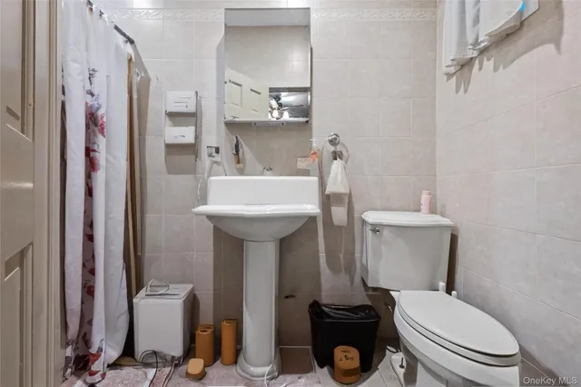 a view of a livingroom with an empty space and a flat screen tv