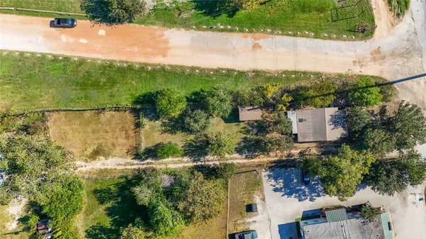 a aerial view of residential house with pool and garden