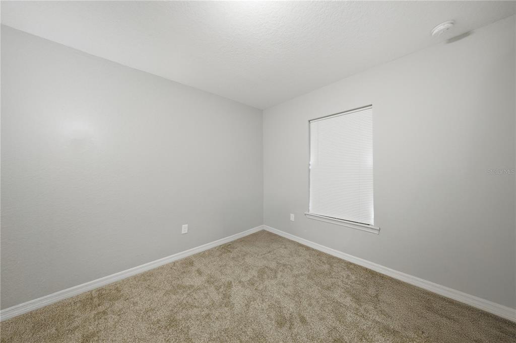 157 Spruce Road Ocala, FL 34472 - Photo 15 of 19 an empty room with a workbench