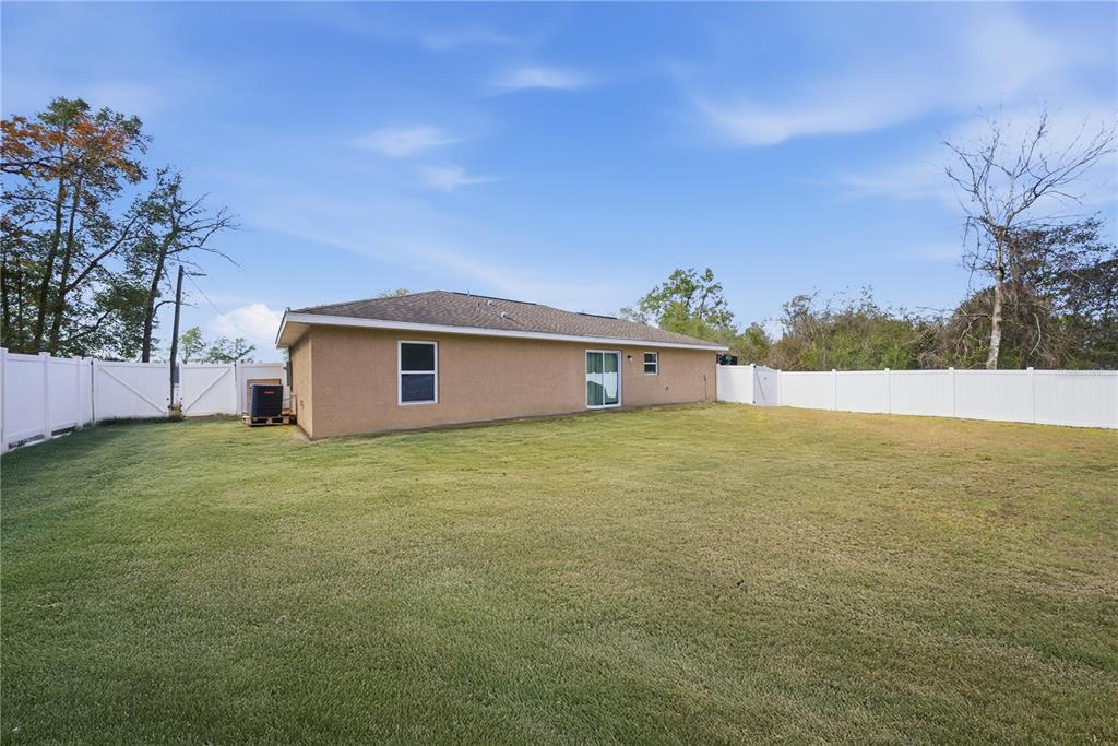 157 Spruce Road Ocala, FL 34472 - Photo 17 of 19 a outdoor view of a house with a garden