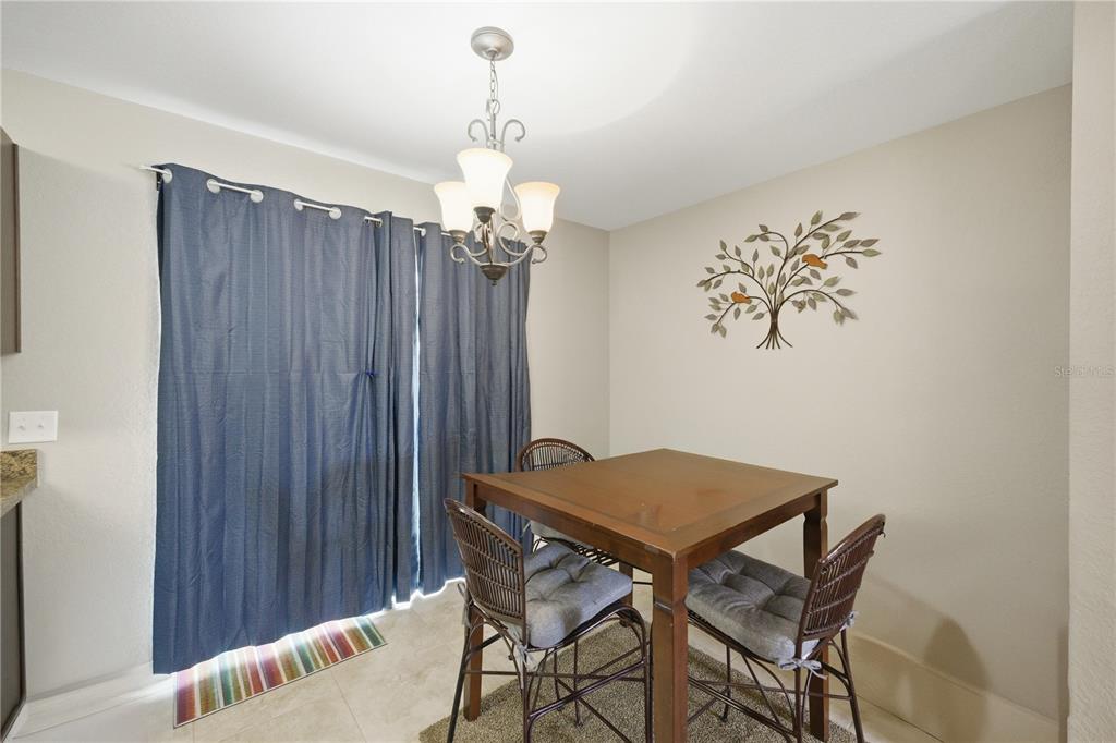 157 Spruce Road Ocala, FL 34472 - Photo 8 of 19 a view of a dining room with furniture and chandelier