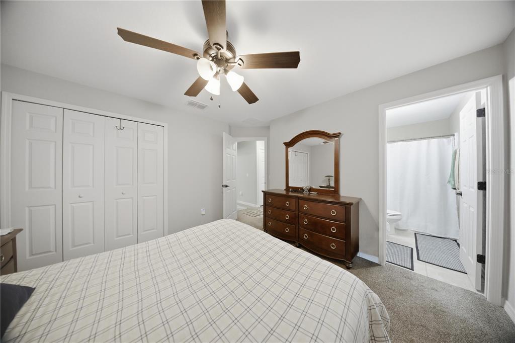 157 Spruce Road Ocala, FL 34472 - Photo 10 of 19 a bedroom with a bed and a dresser