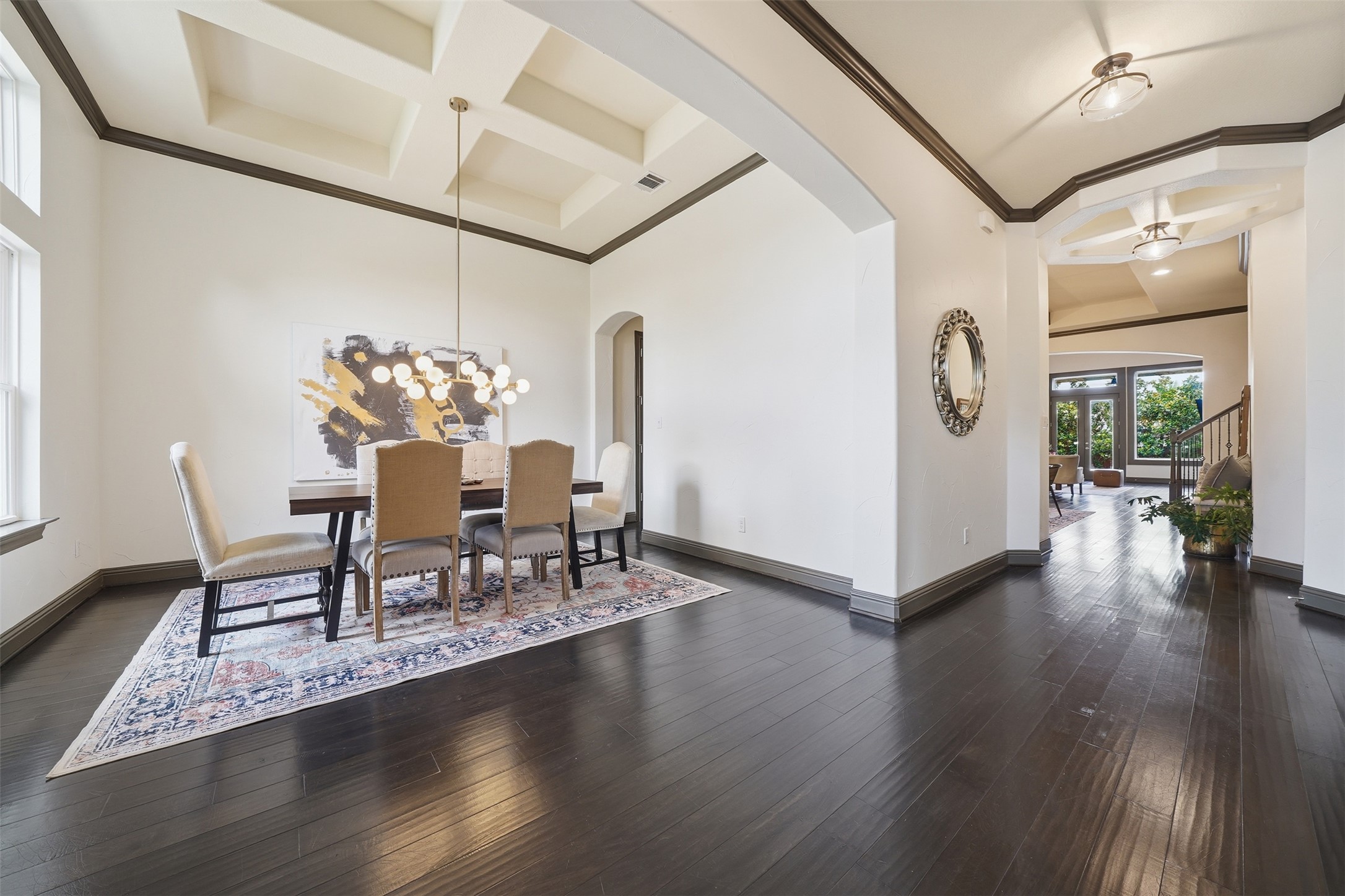 8729 Vantage Point Drive Austin, TX 78737 - Photo 6 of 33 Elegant dark hardwood floors extend through this formal dining area and into the grand entry.