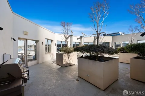 a view of a living room and kitchen