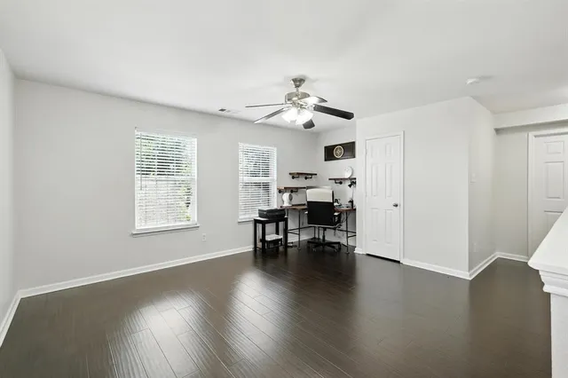 a view of a livingroom with furniture and a window