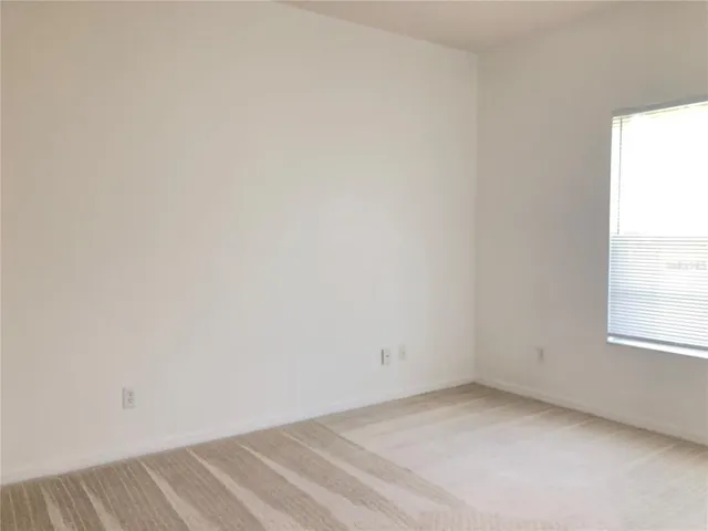 a bathroom with a sink and mirror with toilet