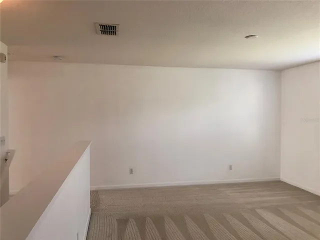 a view of a livingroom with a staircase