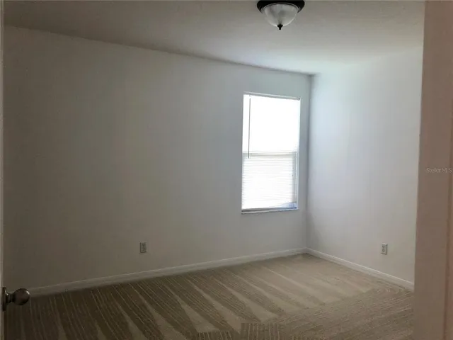 a kitchen with stainless steel appliances granite countertop a refrigerator oven a sink dishwasher and a stove with wooden floor