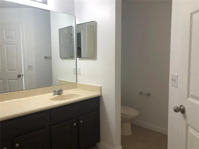 a kitchen with stainless steel appliances granite countertop a refrigerator and a stove