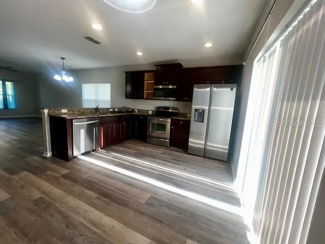 a view of wooden floor and staircase