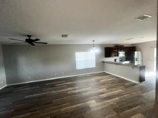 a view of a kitchen with a sink and cabinets