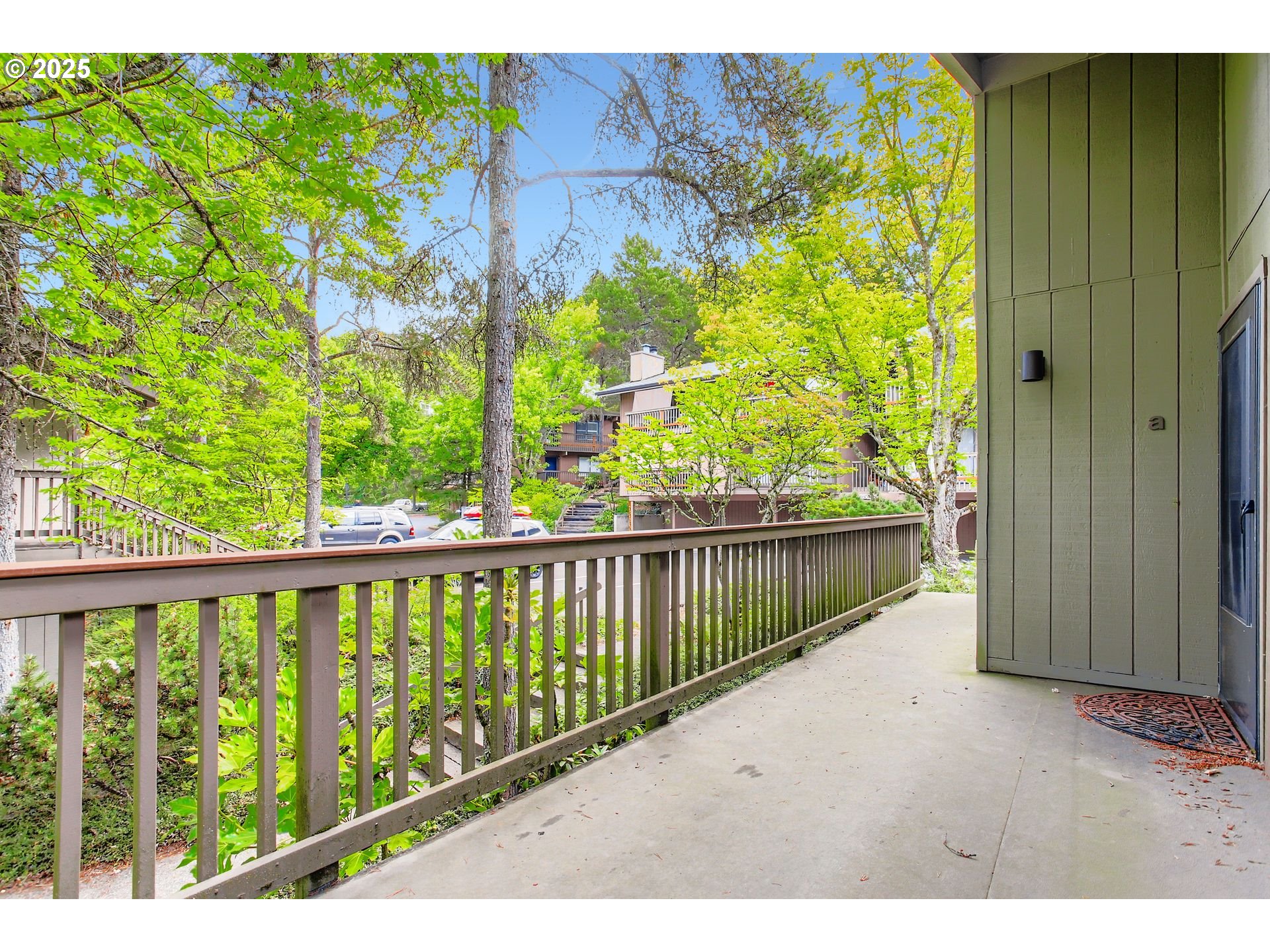 7514 Southwest Barnes Road, Unit A Portland, OR 97225 - Photo 21 of 24 a view of a balcony with wooden floor