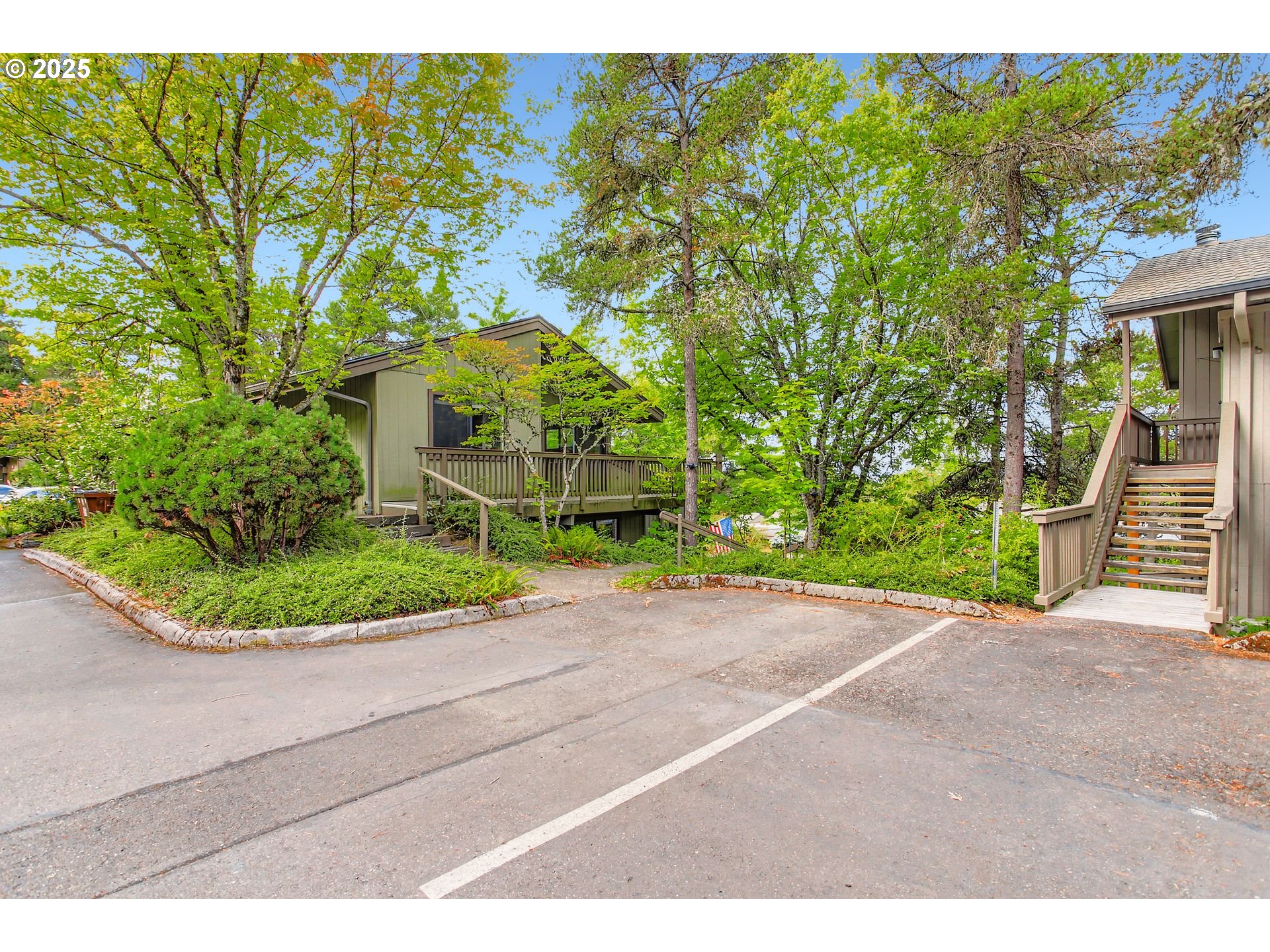 7514 Southwest Barnes Road, Unit A Portland, OR 97225 - Photo 24 of 24 a view of a backyard with potted plants