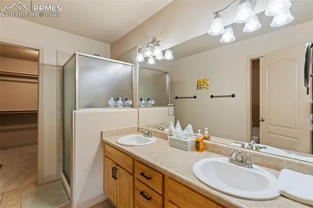 a bathroom with a double vanity sink and a mirror