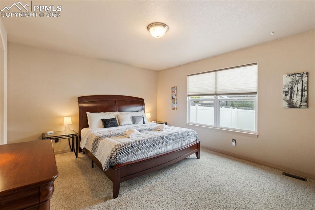 4005 Siferd Boulevard Colorado Springs, CO 80917 - Photo 13 of 27 a bedroom with a bed and window