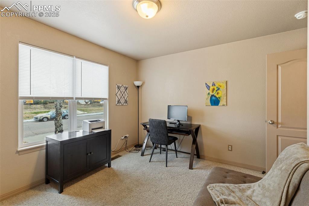 4005 Siferd Boulevard Colorado Springs, CO 80917 - Photo 14 of 27 a view of a workspace with furniture and a window