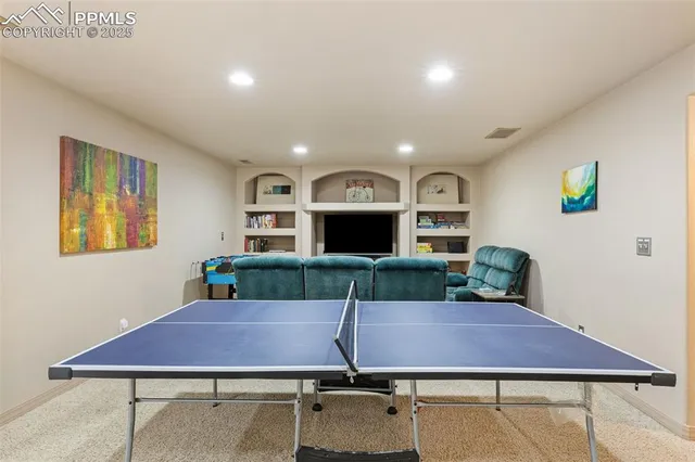 a view of a house with a chairs and table in a room