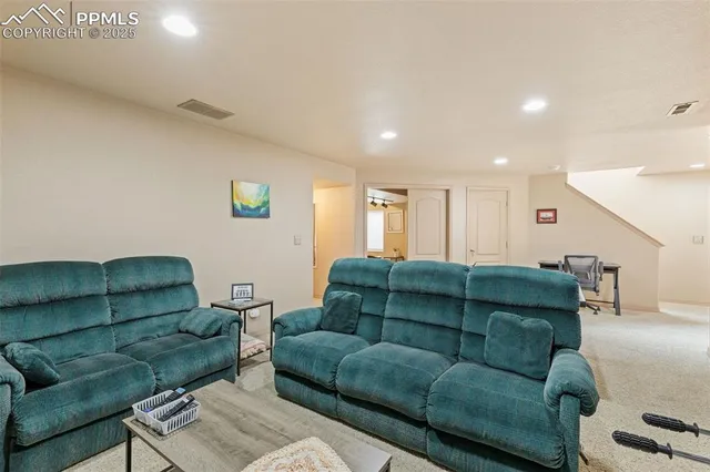a living room with furniture and a couch