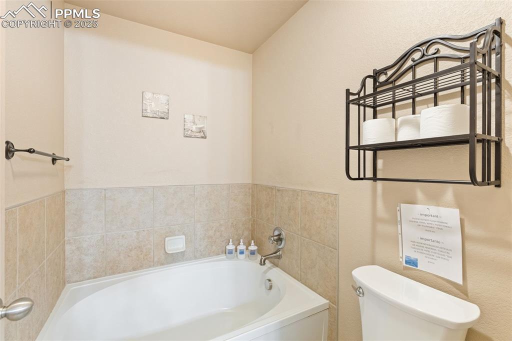 4005 Siferd Boulevard Colorado Springs, CO 80917 - Photo 23 of 27 a bathroom with a sink a toilet and a shower