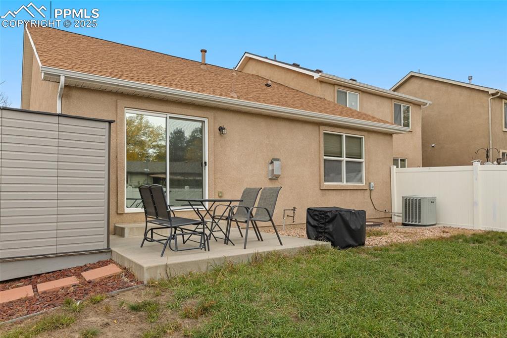4005 Siferd Boulevard Colorado Springs, CO 80917 - Photo 24 of 27 a view of a patio with table and chairs and potted plants