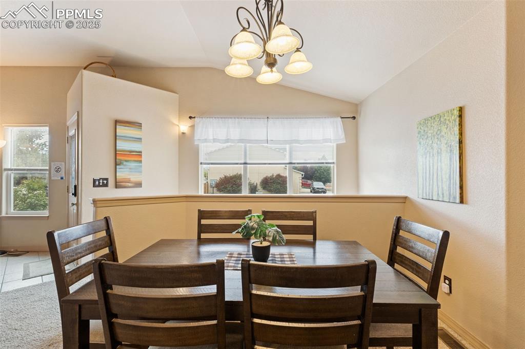 4005 Siferd Boulevard Colorado Springs, CO 80917 - Photo 8 of 27 a view of a dining room with furniture window and outside view
