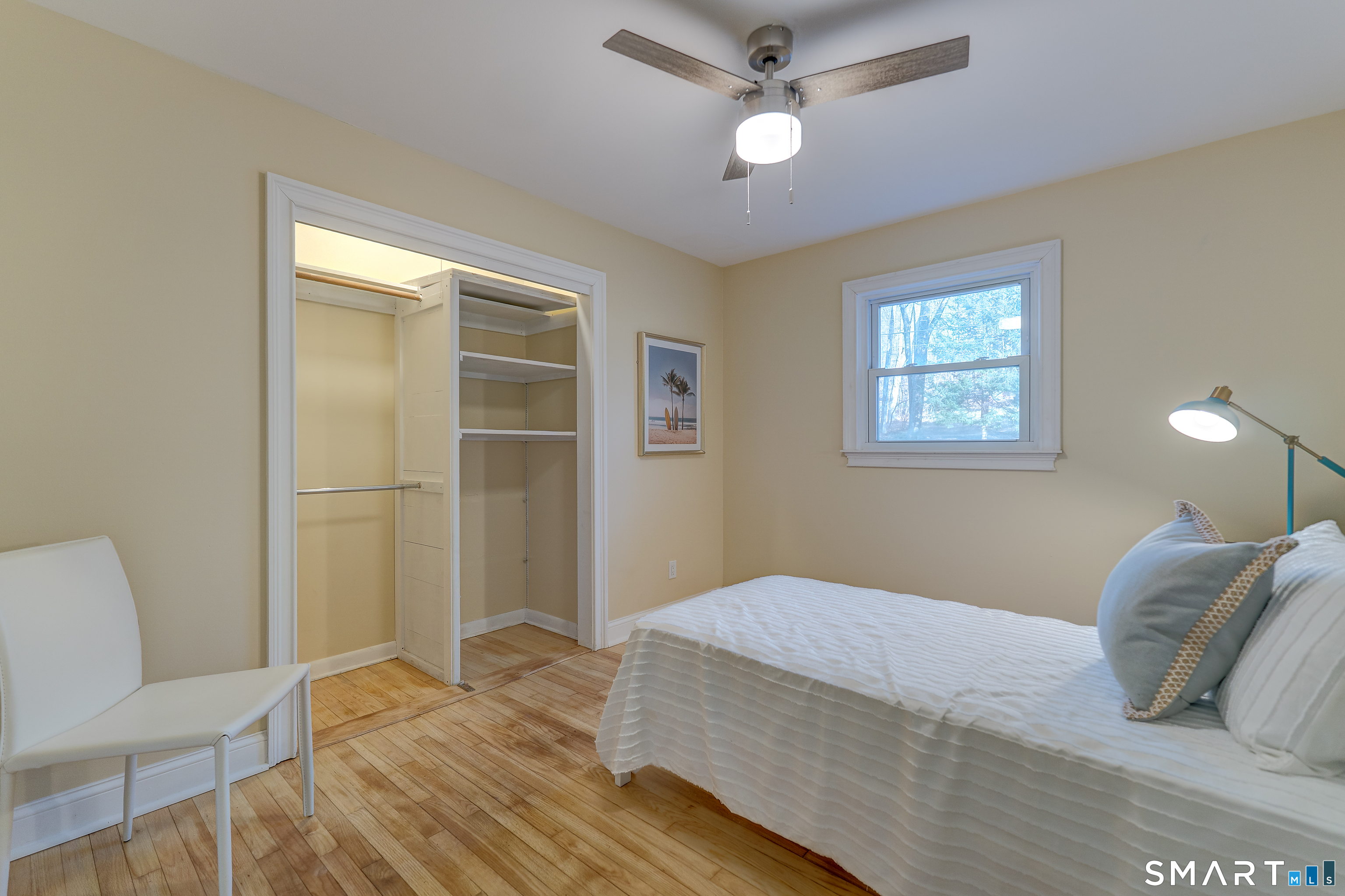 24 Evergreen Road North Branford, CT 06472 - Photo 14 of 24 a bedroom with a bed and a chandelier